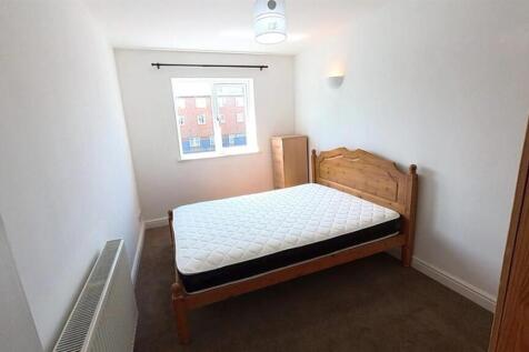 Bright bedroom with double bed and natural ligh...