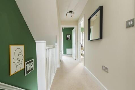 Bright and welcoming landing connecting rooms seamlessly