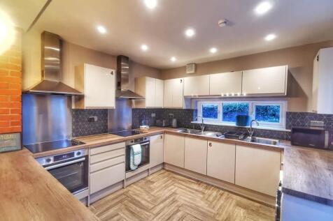 Modern spacious kitchen with sleek appliances...