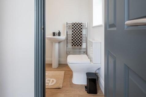 Bright modern bathroom with heated towel rail...