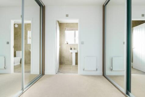 Bedroom one boasts its own dressing area