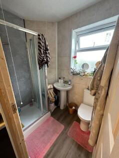 A bright and functional bathroom featuring a sh...