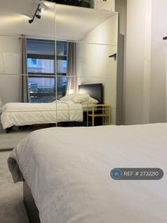 Bedroom With Full-Height Mirrored Double Wardrobes