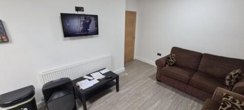 A modern and inviting living room featuring a c...