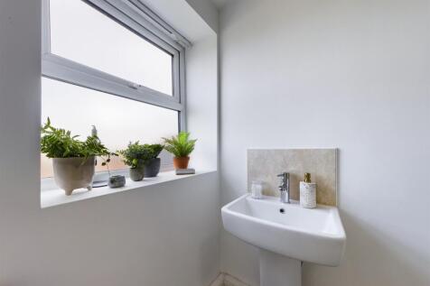 A bright and clean bathroom featuring a stylish...
