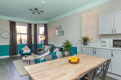 A stylish and spacious modern living room, perf...