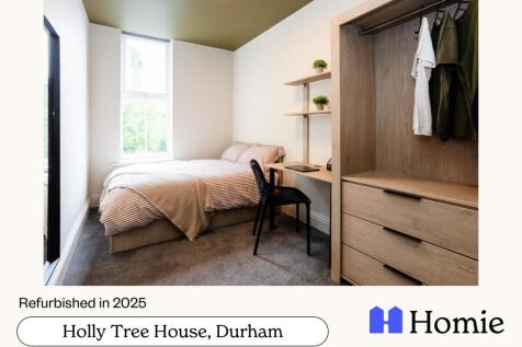Bright and inviting bedroom with a cozy bed, am...
