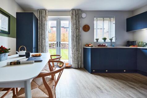 French doors open up to the rear garden, perfect for alfresco dining