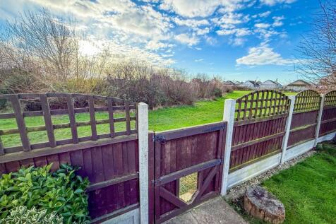 VIEWS OF GREENSWARD TO REAR