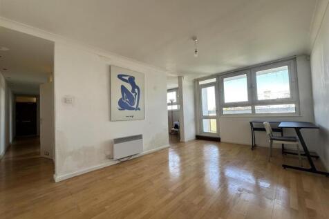 Bright, airy living room with large windows, li...