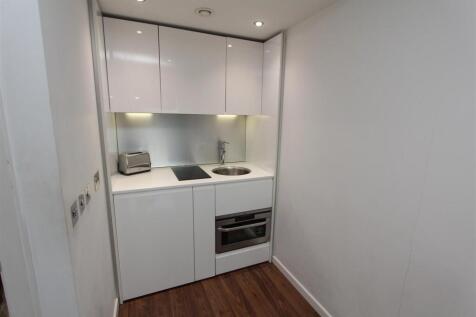 Sleek contemporary kitchenette with high gloss ...