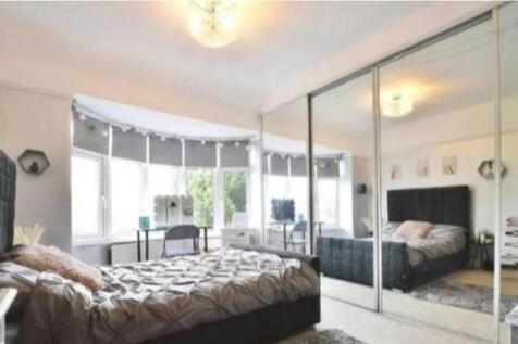 Bright bedroom with huge mirrored wardrobes...