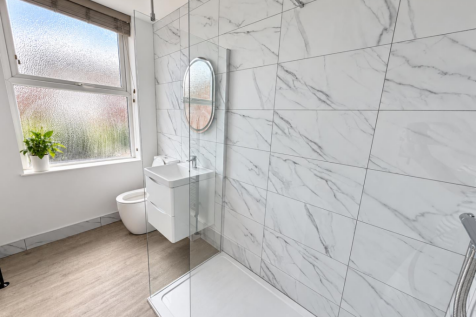 Bathroom window with leafy potted plant-5.png