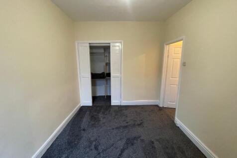 Spacious bedroom with built-in storage space....