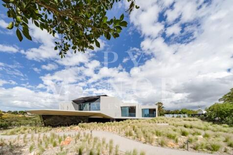 Modern architectural villa in Carvoeiro Algarve set within landscaped natural surroundings
