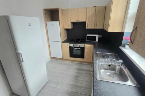 Neat modern kitchen with fitted units and oven...