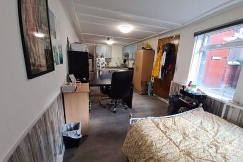 A clean and well-maintained single toilet room ...