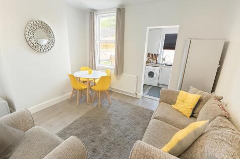 Bright and inviting living room featuring a com...
