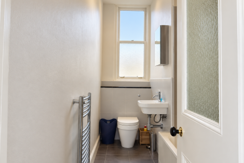 Narrow Modern Bathroom with Frosted Window