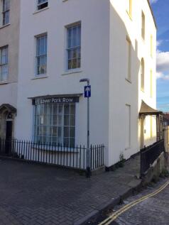 Elegant white period building with large window...