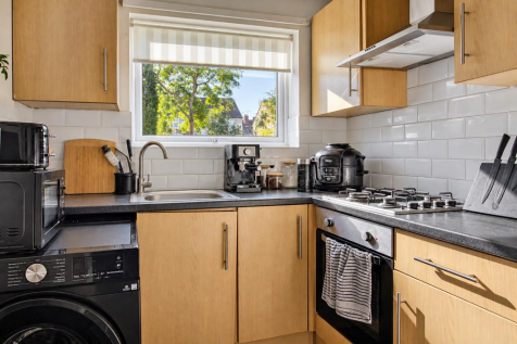 Sunlit Modern Oak Kitchen with Coffee Corner.png
