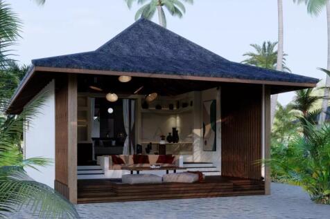 A small, open-fronted tropical hut with a dark, pi