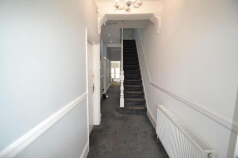 Clean and well-maintained hallway featuring cla...