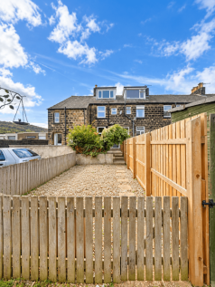 Sunny Stone Terrace Garden with Gravel Yard