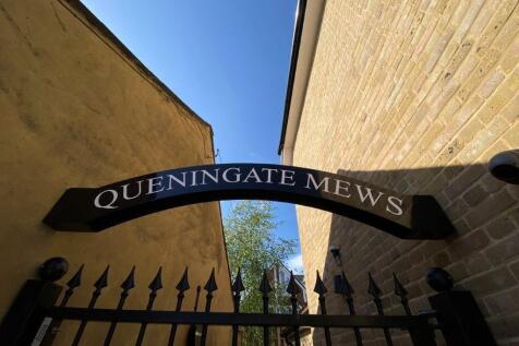Elegant gated entrance with modern signage...