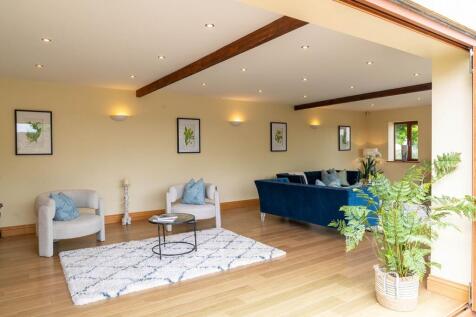Spacious, light lounge with bi fold doors onto patio