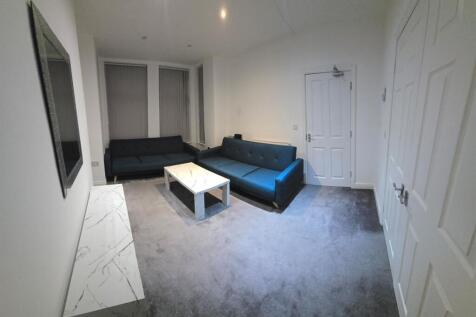 Modern living area with sleek blue sofas...