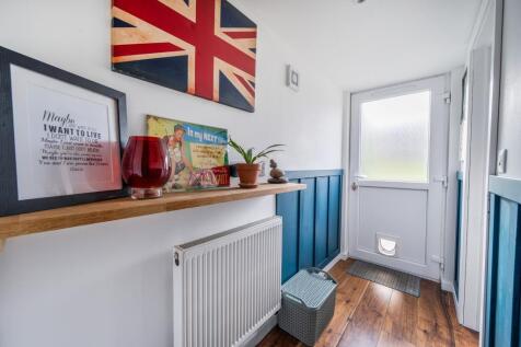 Back door, utility area leading to W/c