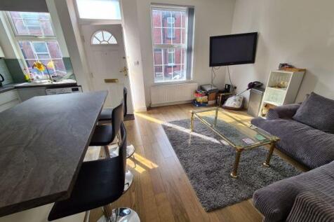 A bright and inviting living room featuring a m...