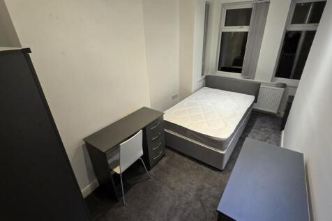 Bright modern bedroom with dedicated study desk...