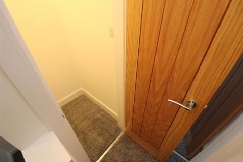 Clean, modern storage area with soft carpet...