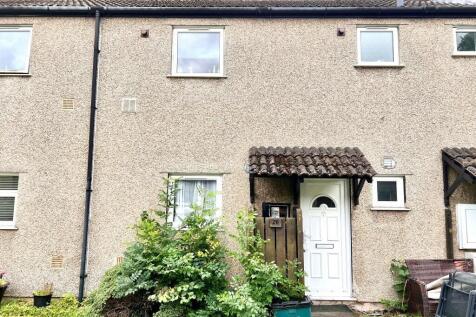 A charming exterior shot of a terraced house sh...