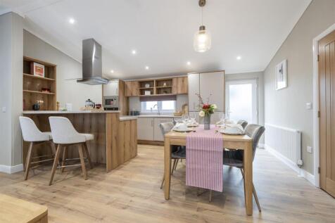 ALTERNATE VIEWS OF KITCHEN &amp; LIVING AREA