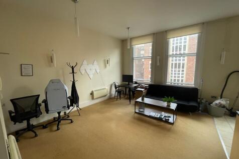 Bright, spacious living area with large windows...