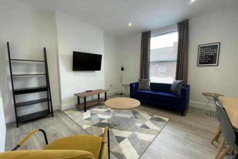 A spacious and stylish modern living room with ...