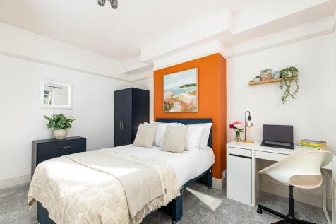 Bright, stylish bedroom with double bed and des...