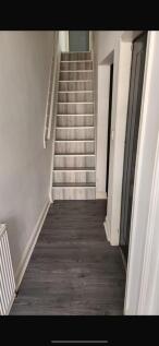 Modern hallway with stylish wooden flooring...