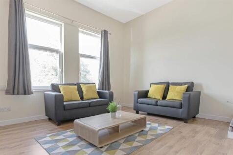 Bright, neatly presented living room with match...