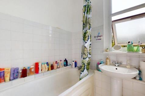 Bright bathroom suite with natural window light...