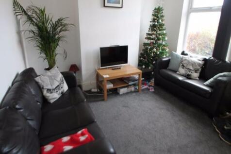 A modern and cozy living room featuring two bla...