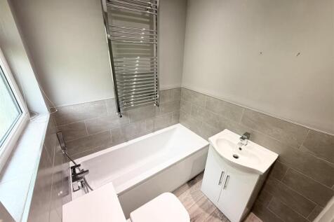 Modern bathroom with full bath and heated rail...