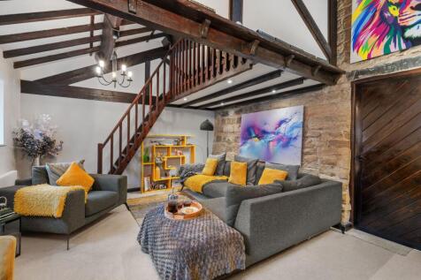 Living room with stairs to mezzanine