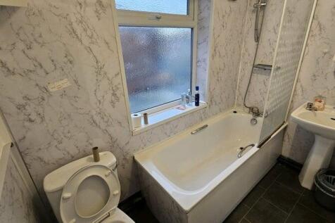 Bright and clean bathroom featuring a full-size...