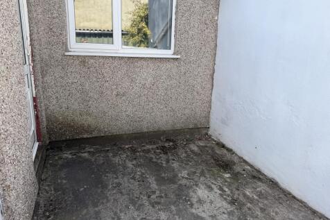 Small enclosed private patio area 