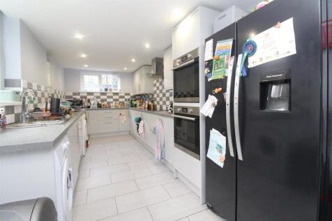 Spacious modern kitchen with large fridge-freez...
