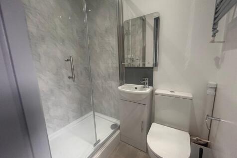 Modern bathroom with shower and vanity...